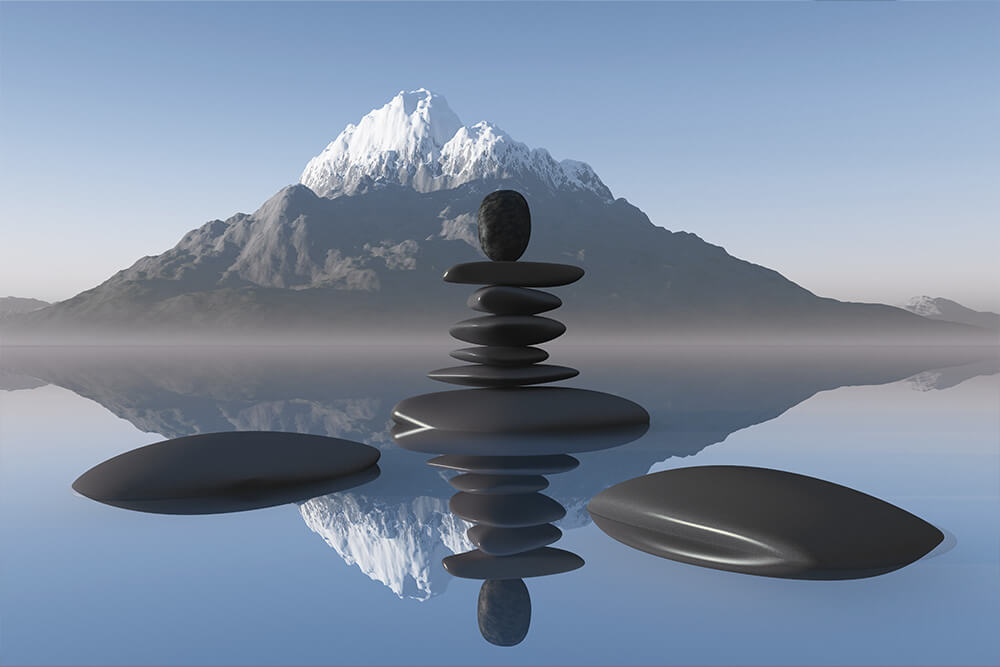 Balance stones in mountain lake